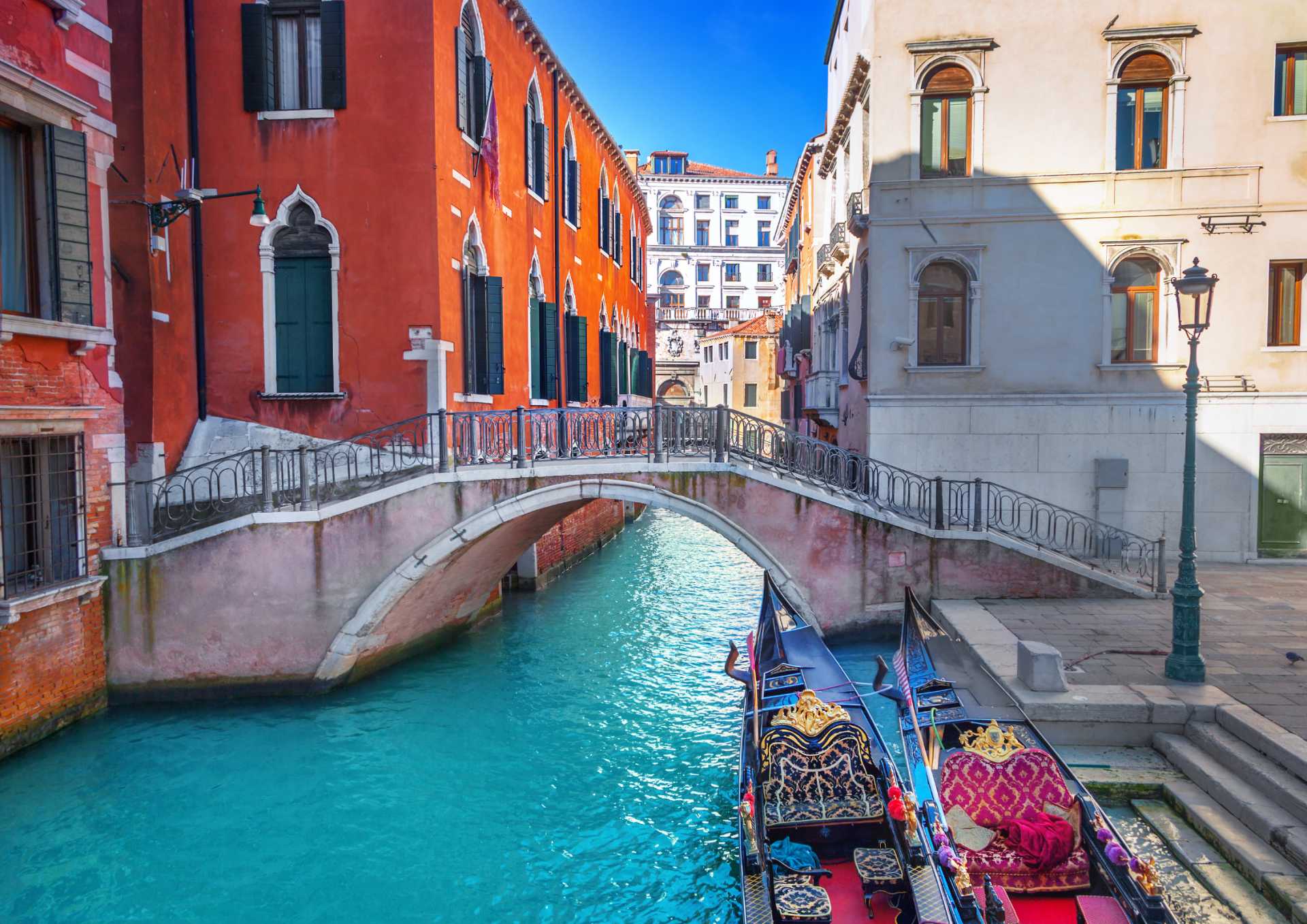 A loving family enjoying a picturesque sunset view from a mountain top during summer.