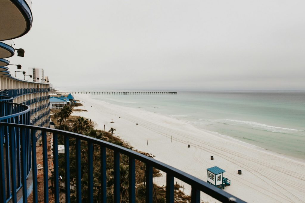 Breathtaking view of Panama City Beach with cloudy skies and turquoise waters.